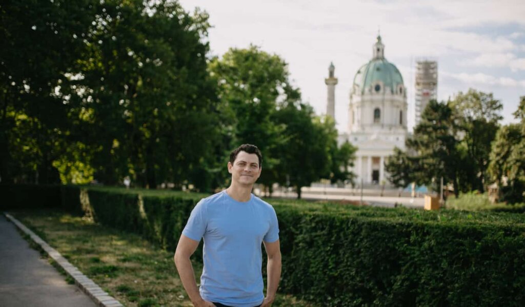 Nomadic Matt posing for a photo in historic Vienna, Austria